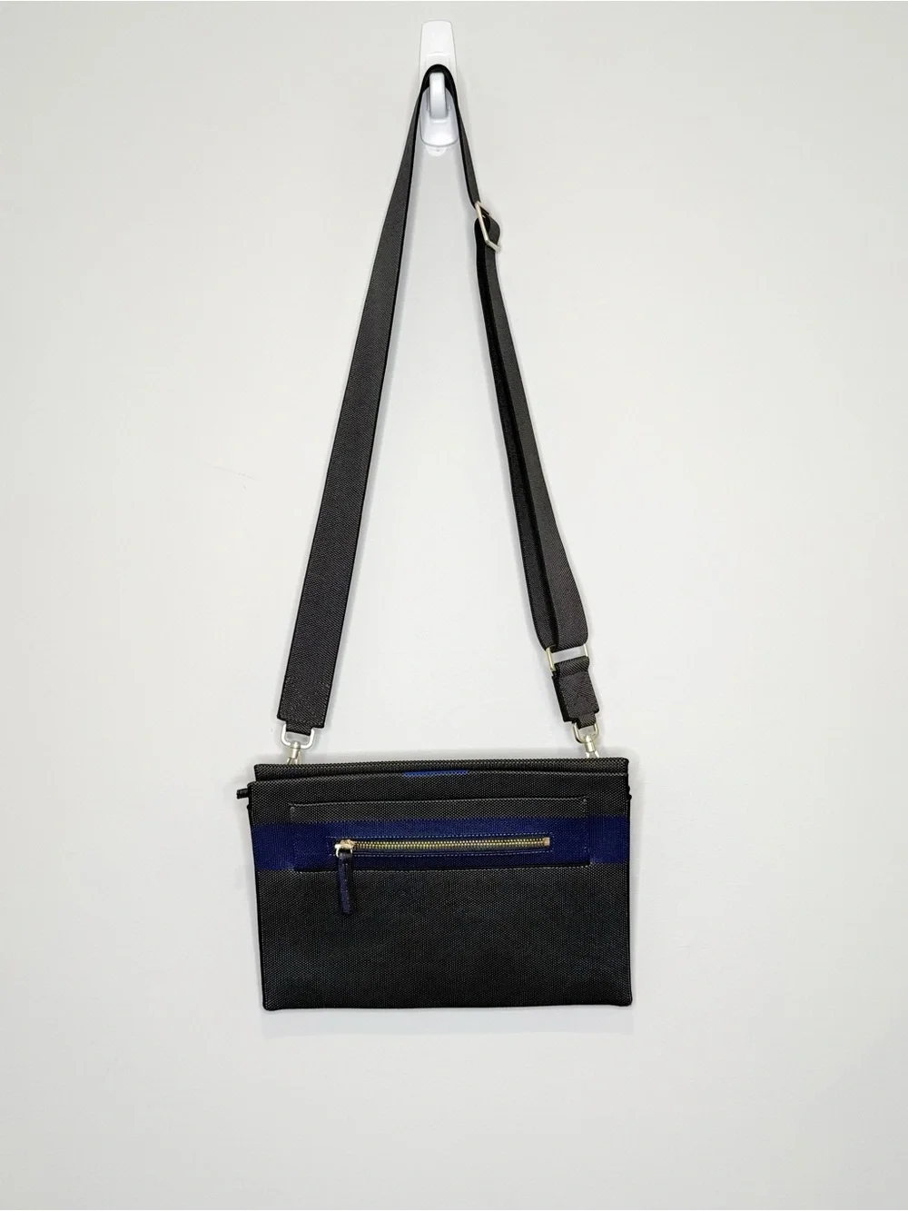 Rothy’s dark gray and blue fabric crossbody clutch or shoulder bag